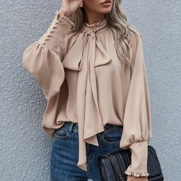 Get Ready for the Season with this Chic and Trendy European and American High-necked Blouse featuring a Tie-neck and Bubble Sleeves perfect for a Fashionable Look