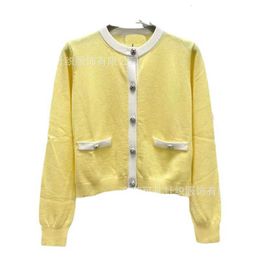 Designer Women's Sweaters MIU Home Knitted Round Neck Long sleeved Cashmere Cardigan Sweet Age Reducing Style Coat Top Short AutumnWinter New Product 7JT7