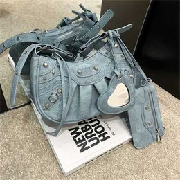 Number 5821 Women's Bag New Locomotive Underarm Rivet Tassel Three in One Fold Single Shoulder