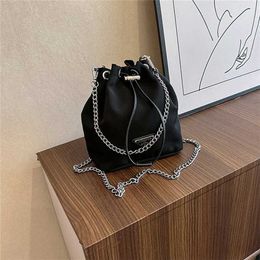 Versatile new triangular nylon canvas mini niche bucket bag double chain drawstring single shoulder handbag for women Factory Online 70% sale