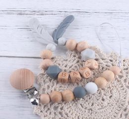 INS baby Silicone Wooden Soothers Teethers Feather Shape And Beads Bell Design Health Care Teething Training Infant9594162