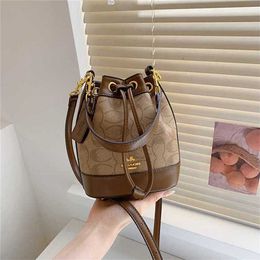 Western style women's 2023 new fashionable portable bucket version large capacity single shoulder texture hardware crossbody bag 70% off outlet online sale