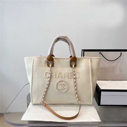 Designer Summer Beach Handbag Letter Shoulder Flash Office High Quality Classic Canvas Bag with Button Retro Women's Luxury BagBag 70% off outlet online sale