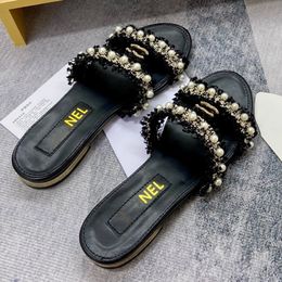 Fransızca lüks inci tasarımcı kadınlar düz terlik scuffs marka sunshine plaj bayan sandaletler 8a kalite lüks deri deri bayan moda gündelik taklit scarpe