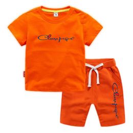 Abiti estivi 0-13 anni Ragazzi Ragazze Lettera di marca Stampata 100% cotone T-shirt arancioni Pantaloncini sportivi Set da 2 pezzi Set di tute casual comfort per bambini