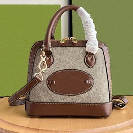 Fashion Cross Body Bag Versatile Women's Shoulder Bag With Metal Buckle Interwoven Letter Logo Design Mini Shell Handbag with Series Code