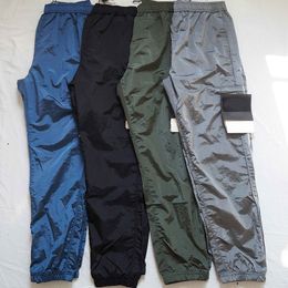 Mens Stone-Washed Nylon Cargo Pants with Embroidered Badge and Reflective Accents