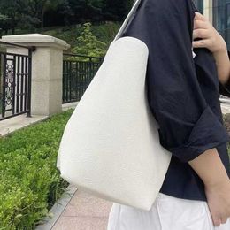 The Row bag is made of genuine leather, with a large capacity one shoulder bucket bag and a large tote bag. It is a fashionable and casual commuting bag 240125