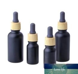 wholesale 10ml 30ml Matte black glass essential oil bottles Glass Dropper Vials Cosmetic Containers Plastic Wood grain lids ZZ