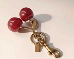 Designer Key Chain Cherry Style Red Chapstick Wrap Lipstick Cover Team lipstick Cozybag Part Mode Fashion