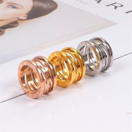 Top Quality Stainless Steel Hollow out Spring ring Women Designer Roman numerals Rose Colors Lover engagement Fashion Couple Jewel3221