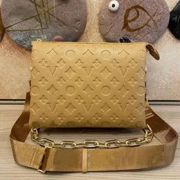 2024 High Quality Small Pockets COUSSIN Real Leather Women's Men's Tote Crossbody Designer Bag Fashion Press Purse Gold Chain