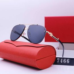 2024 New overseas frameless sunglasses for men and women street photography classic travel fashion glasses 7466