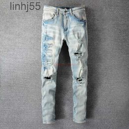 Men's Jeans Designer Clothing Amires Denim Pants Amies 697 High Street Broken Letter Sticker Cloth Used Wash Water Elastic Fit Ins Blue58EB