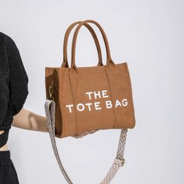 Women's New Thetotebag Canvas Tote Fashion Wide Shoulder Strap Crossbody Bag 2024 Design Fashion 78% Off Store wholesale