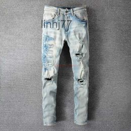 Men's Jeans Designer Clothing Amires Denim Pants Amies 697 High Street Broken Letter Sticker Cloth Used Wash Water Elastic Fit Ins Blue0CSY