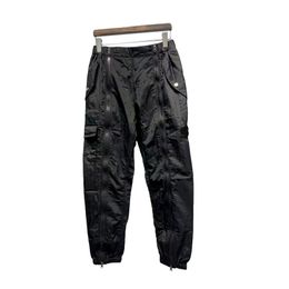 Pantaloni da uomo Pantaloni firmati Pantaloni Topstoney Pantaloni casual in nylon con tasca in metallo Pantaloni cargo riflettenti sottili Pantaloni termoretraibili con cerniera