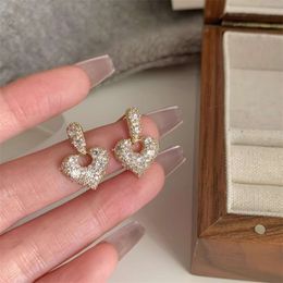 Featuring Niche Design, the Super Sparkling Diamond Hollow Heart Fashionable, Personalized, Versatile for Women. the Earrings Are Light, Luxurious, and High-end