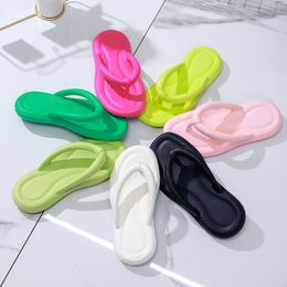 The new female summer fashion outside wear non-slip net red beach eva solid color flat bottom step on shit sense foot flip flops