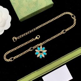 designer necklace jewlery designer for women 18K gold Blue diamond flower necklace