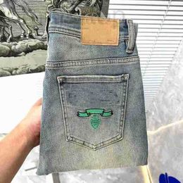 Jeans da uomo Designer classico blu triangolo lettera jeans slim stretch texture lavaggio dritto resistente all'usura top row patch moto pantaloni da lavoro vintage 3HI7 9IJY