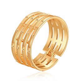 design bracelet new product features a hollowed out design with a smooth surface and multiple layers of lines. wide face bracelet features a simple opening