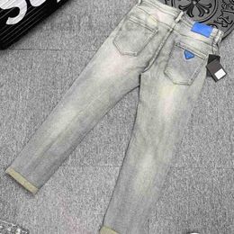 Jeans da uomo Designer Triangolo elasticizzato da uomo Slim azzurro Lettera Stretch marchio Pantaloni di lusso Jean Trend casual JR0L 8I2W