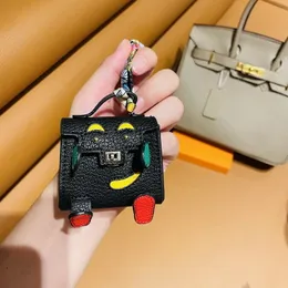 Designer Fashion Keychain Bag Car Keychain Handmade leather Little Monster headphone bag Men Women Purse Bag Pendant Mini fashion keychain accessories