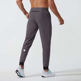 Ll masculino jogger calças compridas esporte yoga outfit secagem rápida cordão ginásio bolsos sweatpants calças casuais cintura elástica fiess lululemens 9913ess