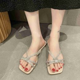 Slippers Sandals Korean version of oversized slippers for womens outerwear 2023 summer new flat bottomed straight line rhinestone sandalsH2435