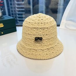 Breathable designer bucket hat versatile outdoor travel beach hat hollowed out woven letter embroidery fashionable fisherman hats