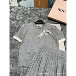 24 early spring new diamond grid short sleeved pullover top Half skirt two-piece set for fashionable casual and sweet style0
