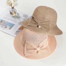 Wide Brim Hats Bucket Hats Pearl bow straw hat with wide brim womens hat with summer sun protection hat bow bucket hat folding beach sun hat J240305