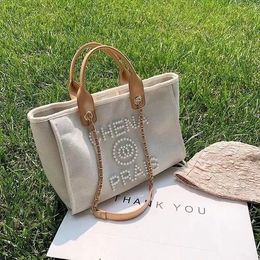 Fashion bag Designer Handbag Women's Beach Bags Large capacity luxury pearl embroidery canvas tote bag women's luxury sense classic chain shopping bag