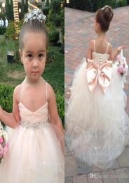 2022 Pageant Dresses For Girls With Bow Spaghetti Straps Flower Girl Dresses White Ivory Champagne Kids Ball Gowns Wedding Sash Be4156301