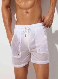 New Summer Mens Shorts Sexy Semitransparent Nylon Quick Dry Shorts Gyms Casual Joggers Home Wear Men Bottoms Shorts H12069433458