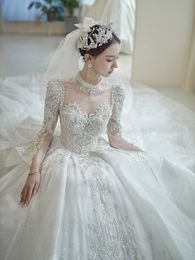 Luxurious Arabic Crystals Sequins Wedding Dresses Ball Gown Sheer Long Sleeves Bling Sparkly Dubai Garden Bridal Gowns Court Train Customised size