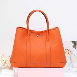 70% Factory Outlet Off Large capacity fashionable leather women's top layer cowhide garden Tongqin multi-function handbag large one slant span bag on sale