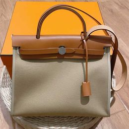 70% Factory Outlet Off top layer cowhide canvas bag One Messenger large capacity handbag on sale