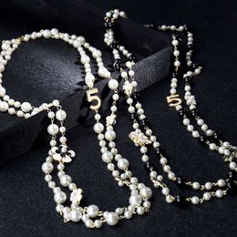 Wholesale New Korean Accessories Multi Layer Small Fragrant Flower Pearl Five Character Pendant Necklace