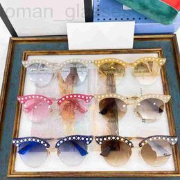 Sunglasses designer 2023 New G Family Pearl Edge Cat Eye Large Frame Metal Gradient Half Fashion Versatile GG0212S 37ZI