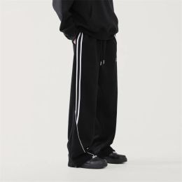 Calça calças de tamanho grande masculino de moda moda casual calça esportiva masculina massache de streetwear calças largas de perna larga calças masculinas calças