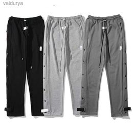 Pantaloni sportivi da uomo con bottoni laterali alti della tuta Streetwear 240308