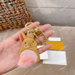 TZ Luxury Designer Keychain Little rabbit key buckle cute Pink tail Unisex Fashion Classic Brand Letter flower Design Gold Keychai262V