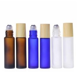 Frosted Amber Clear Blue 5ml 10ml Glass Roll On Bottles Wooden Grain Lid Roller Bottles with Stainess Steel Ball for Essence2750361