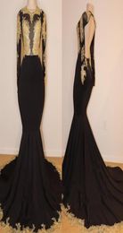 2019 African Black and Gold Mermaid Prom Dresses High Neck Gold Lace Appliques See Through Open Back Long Sleeves Evening Gown4355055