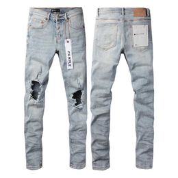 Jeans Purple Brand con fori al ginocchio azzurri e vestibilità slim 9010