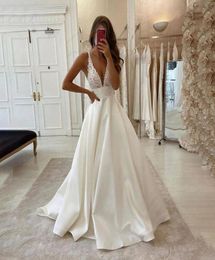 Spaghetti A Line Lace Wedding Dress Bridal Gowns with Pockets V Neck Appliques Sweep Trian Backless Vestidos De Novia6239072