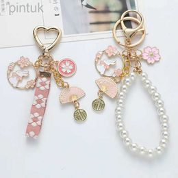 Keychains Lanyards Korean Sweet Cherry Blossom Rabbit Keychain for Women Creative Webbing Pearl Key Chain Handbag Headphone Case Pendant Jewellery ldd240312