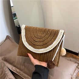 Beach Bags Spring summer Handmade Woven Bags Grass Hand Held Pearl Tassel Bags Small and High End Sensation Envelope